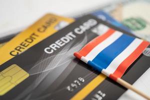 Thailand flag on credit card. Finance development, Banking Account, Statistics, Investment Analytic research data economy, Stock exchange trading, Business company concept. photo