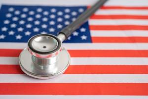 Black stethoscope on USA America flag background, Business and finance concept. photo