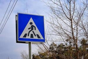 Zebra crossing road sign in the street. photo