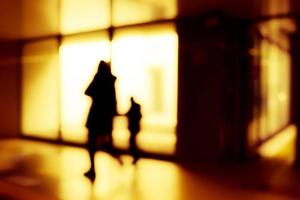 Blurry human silhouette in a subway. Moving human silhouettes in blur. photo