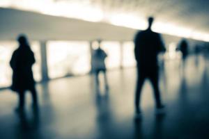 Blurry human silhouette in a subway. Moving human silhouettes in blur. photo