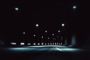 Dark tunnel with light trails photo