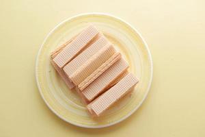 top view of wafer roll chocolate on a plate photo