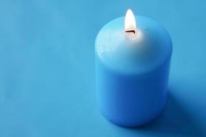 blue color candles slowly burning down. photo