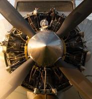 Old airplane propeller visible engine operation. photo