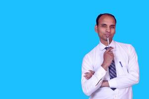 Indian Businessman thinking with pen Standing Pictures, Images and Stock Photos