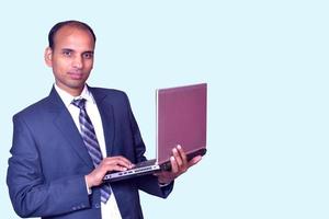 Businessman Standing with laptop Pictures, Images and Stock Photos