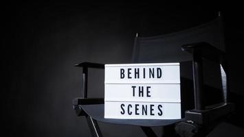 Director chair with behind the scene banner light box. photo