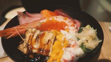 Close up images of japanese seafood rice bowl or kaisendon sashimi donburi. photo