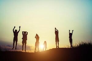 Silhouette of children jump gladness happy time photo