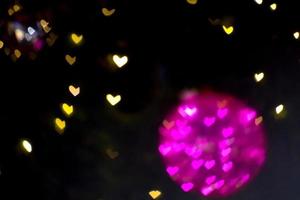 bola magenta bokeh y desenfoque corazón forma amor san valentín colorido noche luz foto