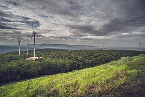 Landscape View of Windmill Farm in the Mountains. Power electrical plant supply from natural energy infinity source.
