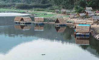 Raft Houses bamboo bungalow floating on Lake in Khao Luang National Park. Sukhothai Thailand.