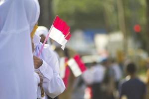 Sorong, West Papua, Indonesia, October 4th 2021. State Visit of the President of Indonesia, Joko Widodo. School children and teachers welcomed the president's arrival from the side of the road. photo