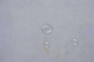 Water bubble falling on the ground photo