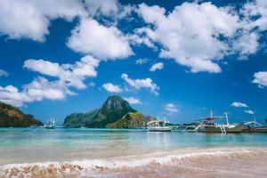 El Nido bay with boats on the beach and Cadlao island, Palawan, Philippines photo