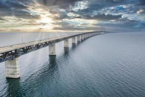 Panoramic view of Oresund bridge during sunset over the Baltic sea photo