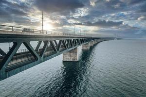 Panoramic view of Oresund bridge during sunset over the Baltic sea photo