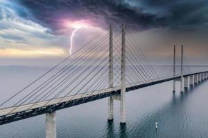 Panoramic view of Oresund bridge during thunderstorm and lightning over the Baltic sea photo