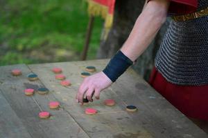 Roman soldier playing a game photo