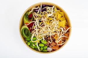 Traditional Hawaiian dish of fresh salmon, rice, vegetables and fruits. Studio Photo