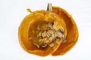 Rotten spoiled pumpkin with seeds. Studio Photo. photo