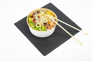 Traditional Hawaiian dish of fresh salmon, rice, vegetables and fruits. Studio Photo