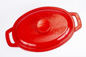 Red ceramic cast iron casserole dish. Studio Photo