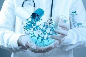 scientist doctor hand holds virtual molecular structure in the lab photo