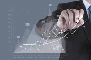 businessman hand draws business success chart photo