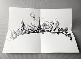 dibujado a mano viajando alrededor del mundo sobre fondo de papel como concepto vintage foto
