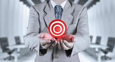 businessman hand shows target symbol as business photo