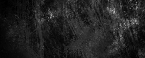 black concrete cement defocused background with dark gray cracks and crumpled wrinkles photo