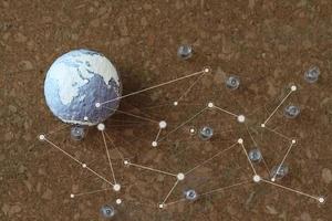 hand drawn texture globe and social network diagram with pin on cork board as concept photo