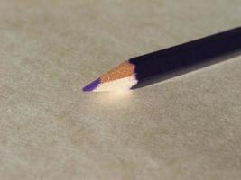 Violet pencil over paper photo