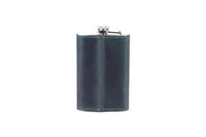 Stainless steel hip flask with leather cover isolated on white background photo