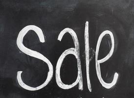 Sale sign on blackboard photo