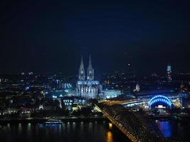 Aerial night view of St Peter Cathedral and Hohenzollern Bridge photo