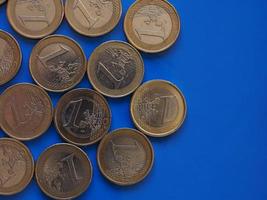 Euro coins, European Union over blue with copy space photo