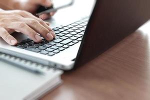 Young creative designer man working with laptop at office as concept photo