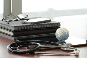 Studio macro of a stethoscope and texture globe with digital tablet with shallow DOF evenly matched abstract as medical network concept Elements of this image furnished by NASA photo