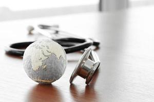 Studio macro of a stethoscope and texture globe with shallow DOF evenly matched abstract as medical network concept Elements of this image furnished by NASA photo