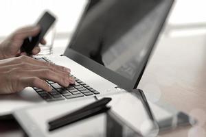 Young creative designer man working with laptop at office as concept photo