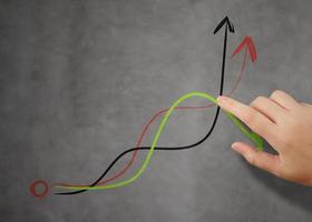 businessman hand pointing to graph and business strategy as concept photo