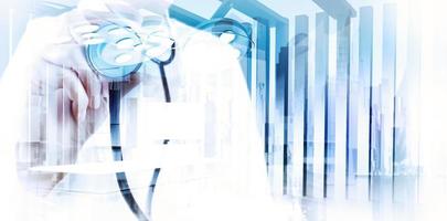 Double exposure of smart medical doctor working with abstract city as concept photo