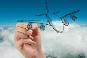 hand drawing airplane on blue sky background photo