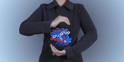 businessman hand showing gears cogs to success concept photo