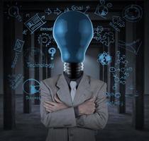 bulb headed man and business plan concept on wall photo