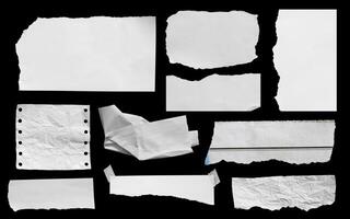 Set of ripped paper isolated on black background.
