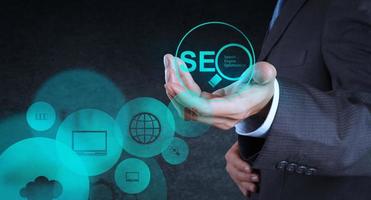 businessman hand showing search engine optimization SEO photo